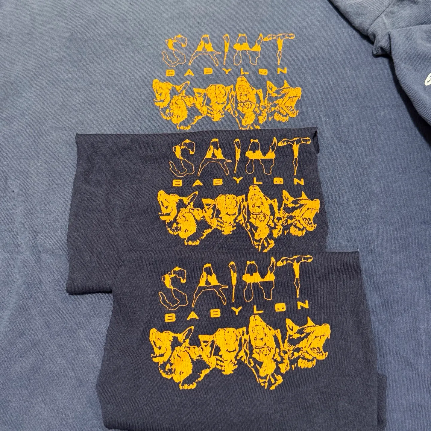 SAINT Mxxxxxx × BABYLON BBLN_LS TEE/SAINT BABYLON/NVY/BABYLON co-branded style Wolf head SAINT/nail distressed long sleeves Washed blue S-XL Completely matched Tube weaving fabric without side seams Garment dyeing Maliu water faded distressing Simulated sun fading treatment Natural fading Handmade holes and frayed Ink splashing treatment Correct main mark/wash mark/little angel anti-counterfeiting mark
